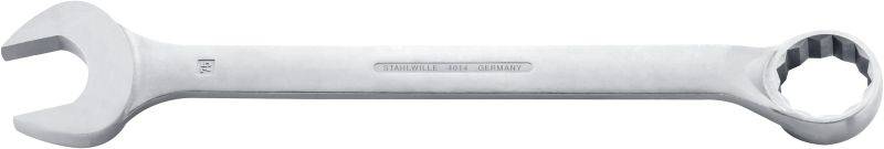 Une clé mixte argentée portant l'inscription 'Gedore Vanadium Germany'. À gauche, une clé à fourche et à droite, une clé polygonale.