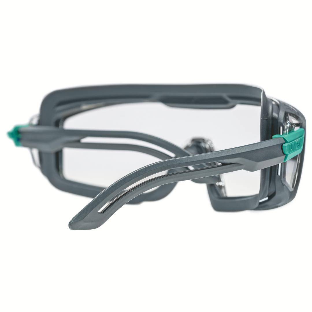 Lunettes de protection grises avec verres transparents et monture renforcée pour applications industrielles.