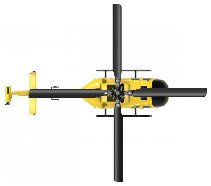 Un hélicoptère jaune vu de dessus, avec quatre longues pales de rotor et un cockpit noir central, est positionné au centre de l'image.