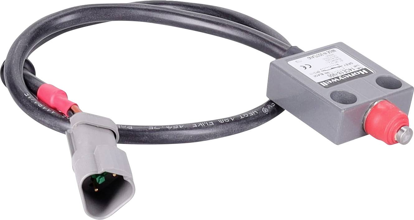 Un câble noir enroulé avec un boîtier de capteur rectangulaire gris et une fiche de connexion grise montrant des broches intérieures vertes.