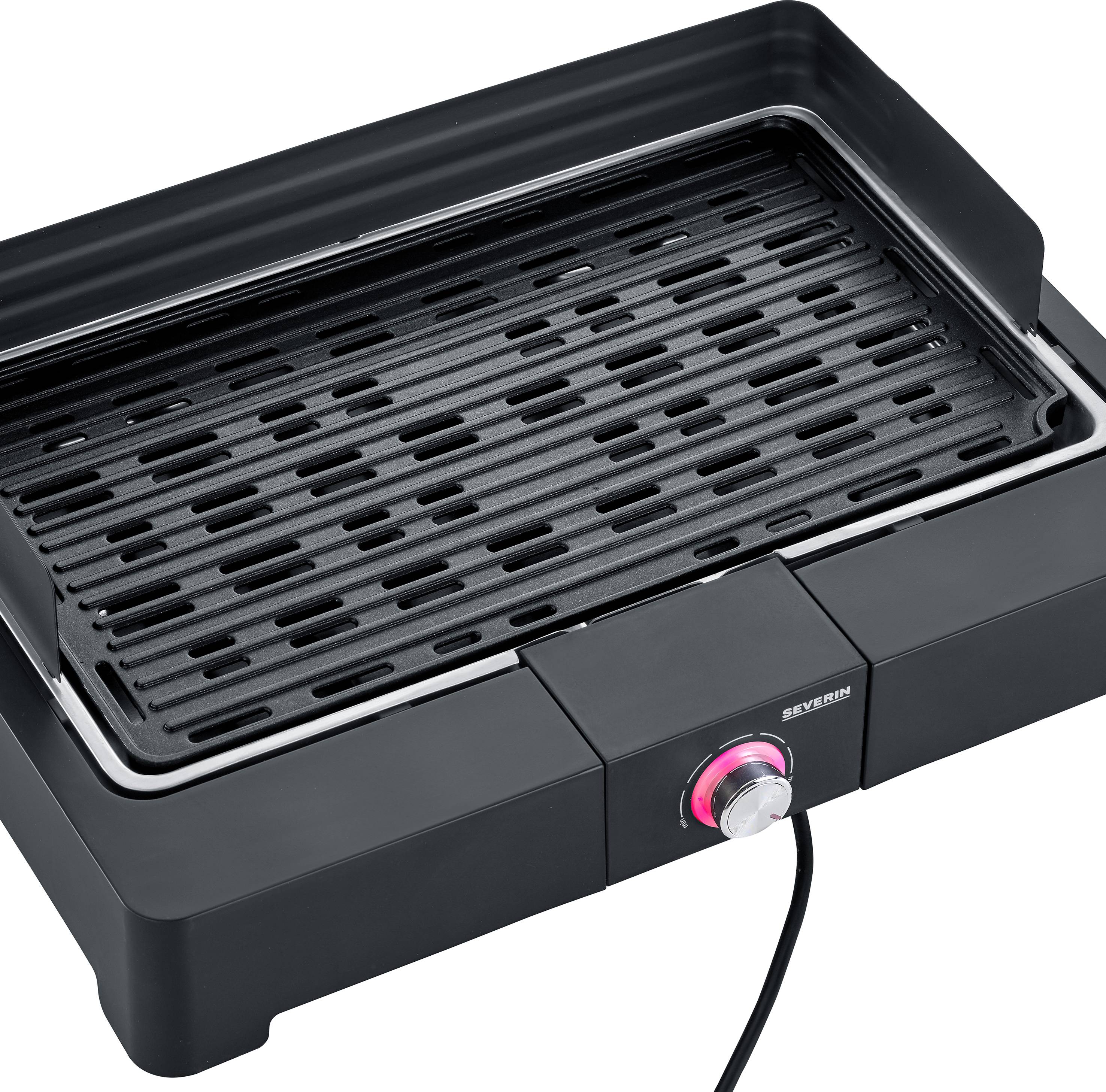 Un grill de table électrique avec une grille noire et un bouton rotatif argenté, adapté pour une utilisation intérieure et extérieure.