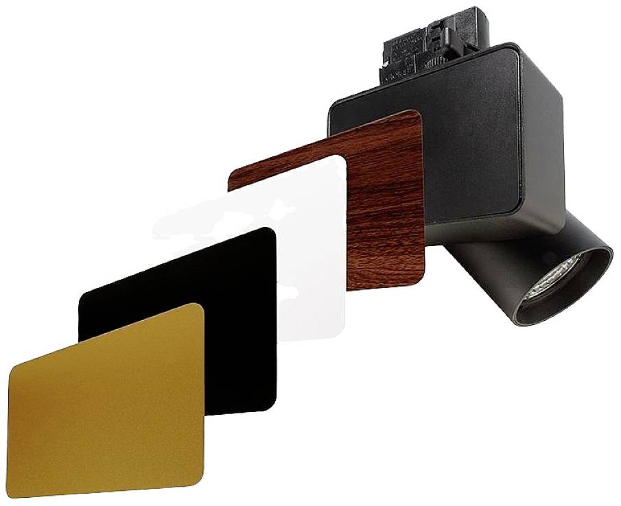 Un projecteur LED noir avec quatre plaques de couverture interchangeables en or, noir, blanc et aspect bois. Idéal pour un éclairage variable.