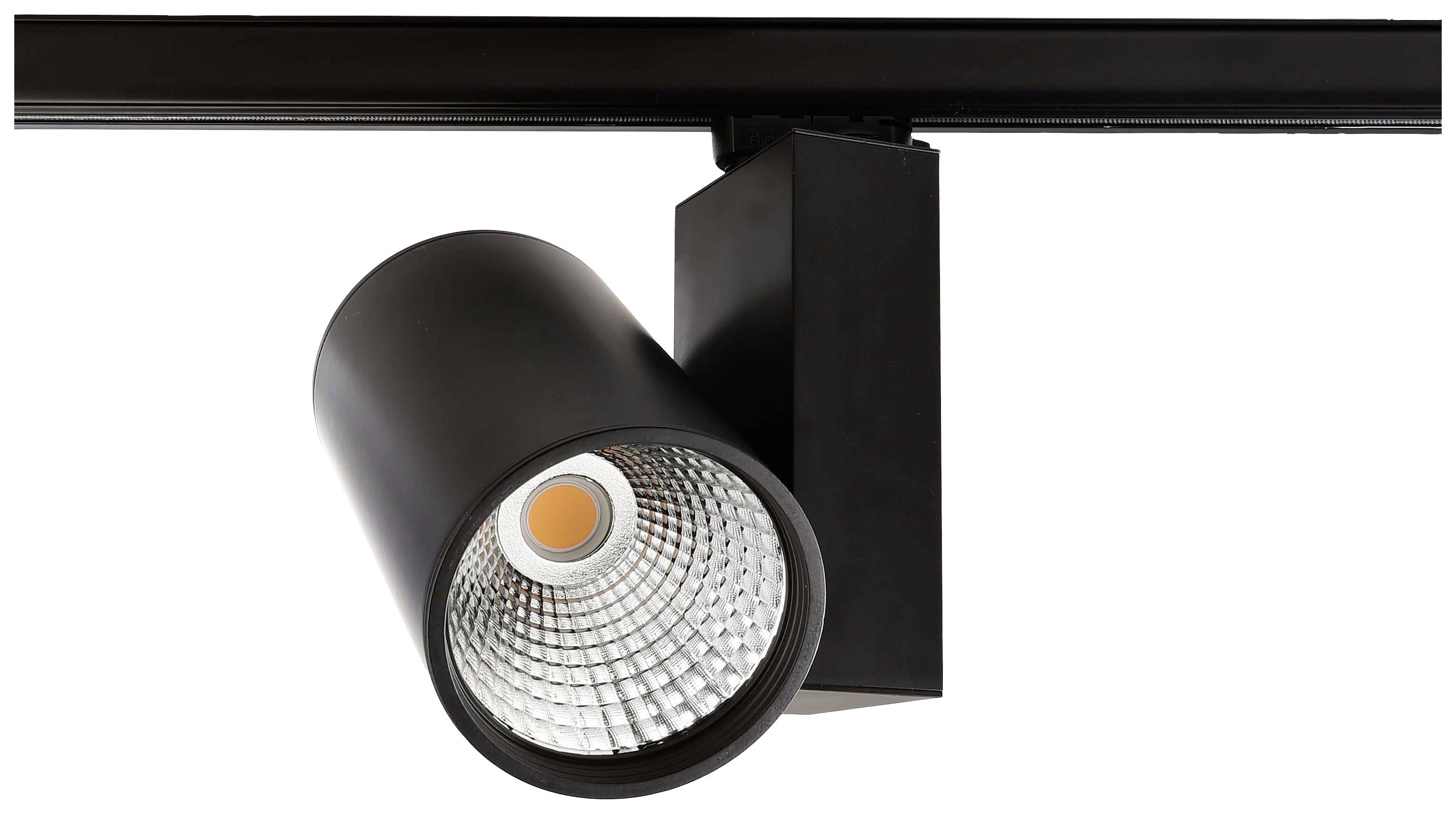 Projecteur LED noir monté sur rail, orienté vers le bas, permettant un éclairage directionnel, adapté aux expositions ou aux magasins.
