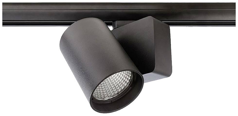 Un projecteur noir sur rail, éclairant précisément une zone. Idéal pour un éclairage d'accentuation dans les espaces intérieurs.