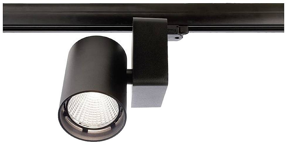 Un luminaire noir sur rail avec un abat-jour cylindrique est suspendu à un support de plafond, prêt à éclairer une pièce.