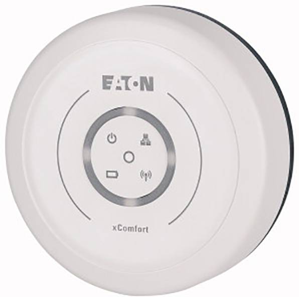 Contrôleur spatial blanc rond avec inscription du logo 'EATON' et 'xComfort'. Symboles : électricité, réseau et indicateur Wi-Fi.