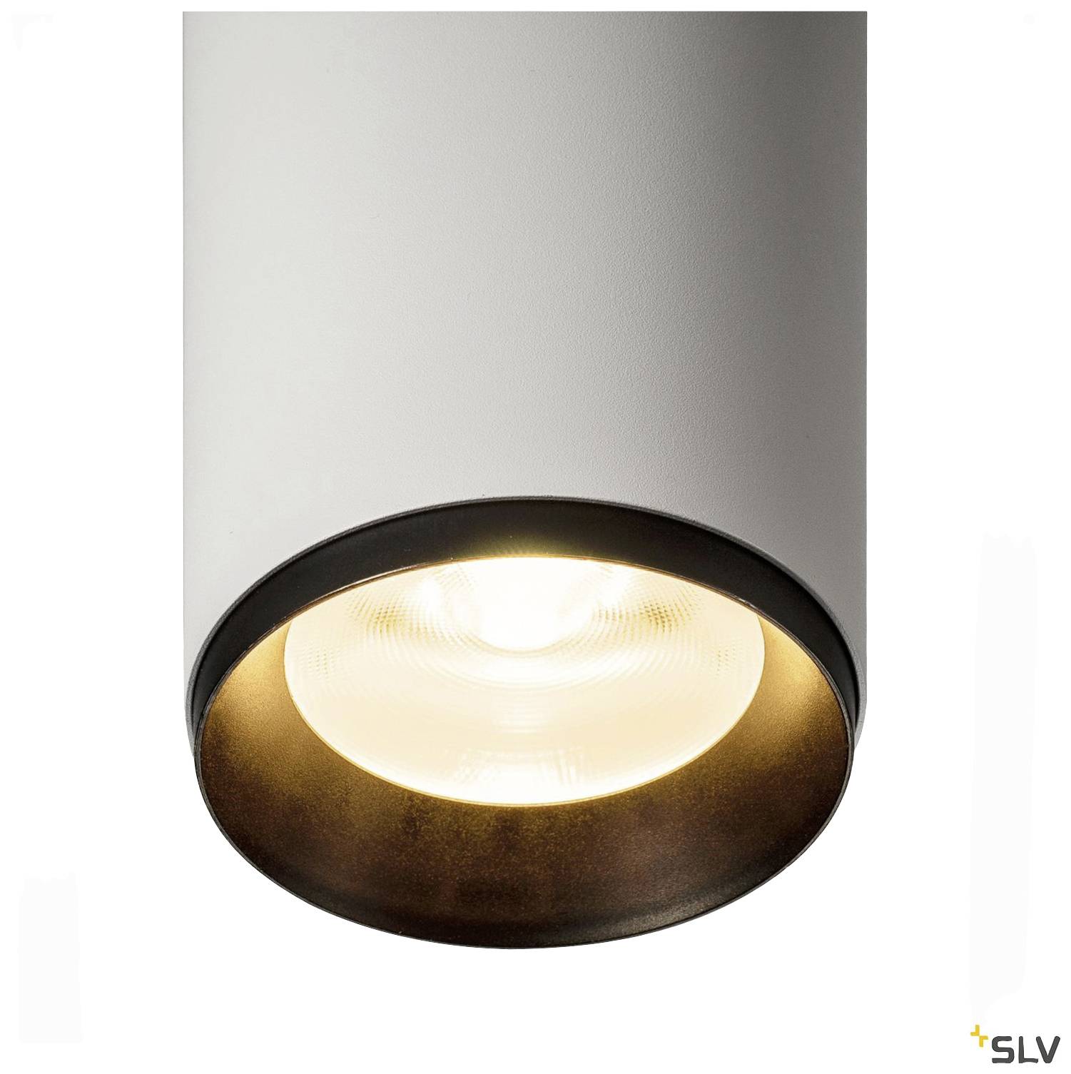 Un luminaire cylindrique blanc avec un abat-jour bordé de noir, diffusant une lumière claire et chaleureuse.