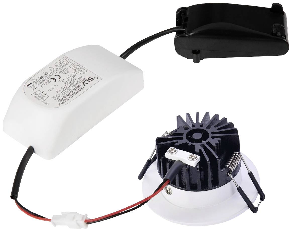 Un module de downlight à LED avec dissipateur thermique et câble de connexion, relié à un pilote LED dans un boîtier blanc.