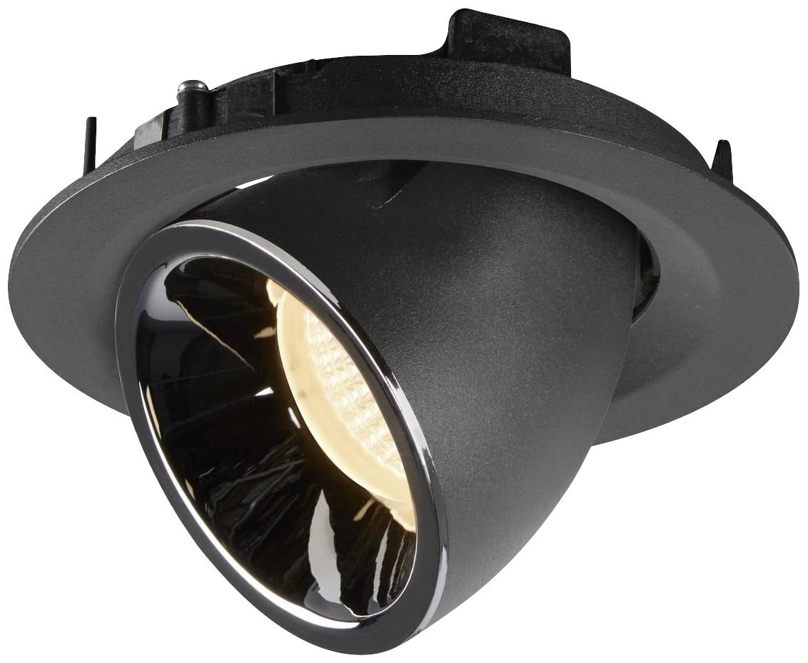 Un projecteur de plafond noir et rond, avec un cône lumineux concentré, installé pour une solution d'éclairage moderne.