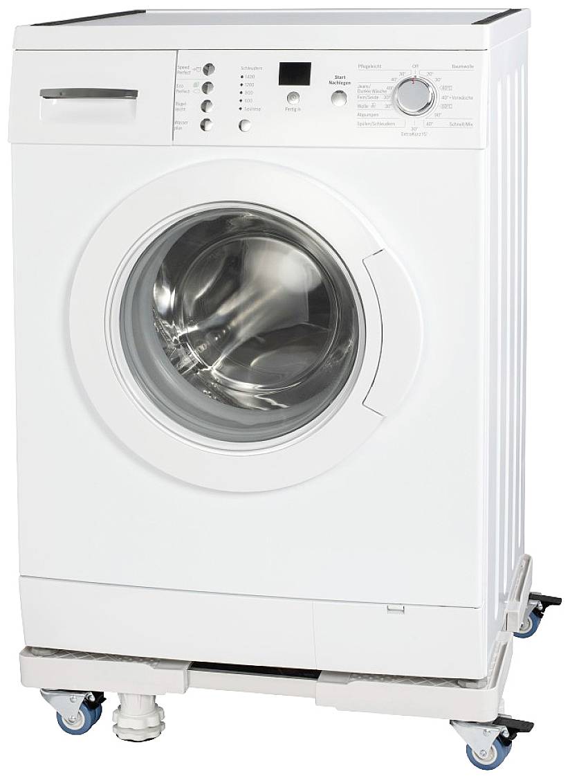 Machine à laver blanche installée sur un support mobile avec des roulettes verrouillables. Le panneau de commande présente plusieurs boutons et un bouton rotatif.