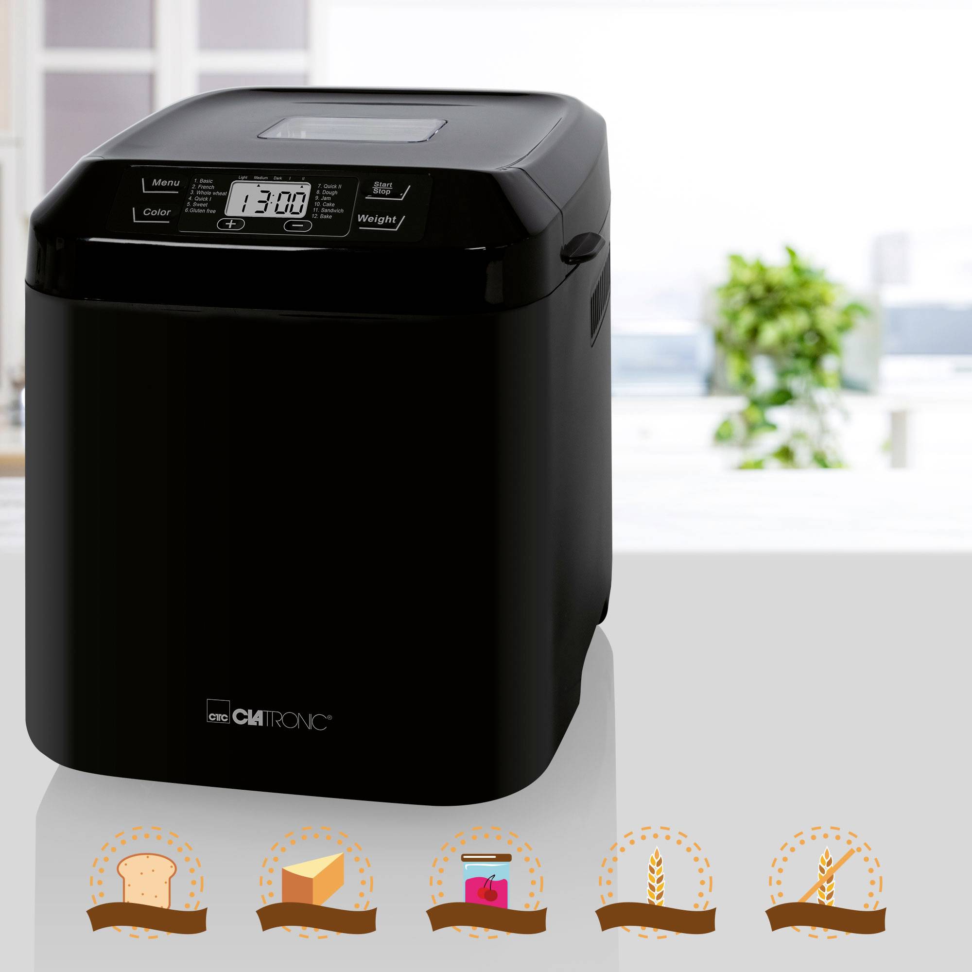 Machine à pain noire sur un comptoir de cuisine, l'affichage indique '1:30'. Symboles en bas : Toast, gâteau, pain complet et chips.