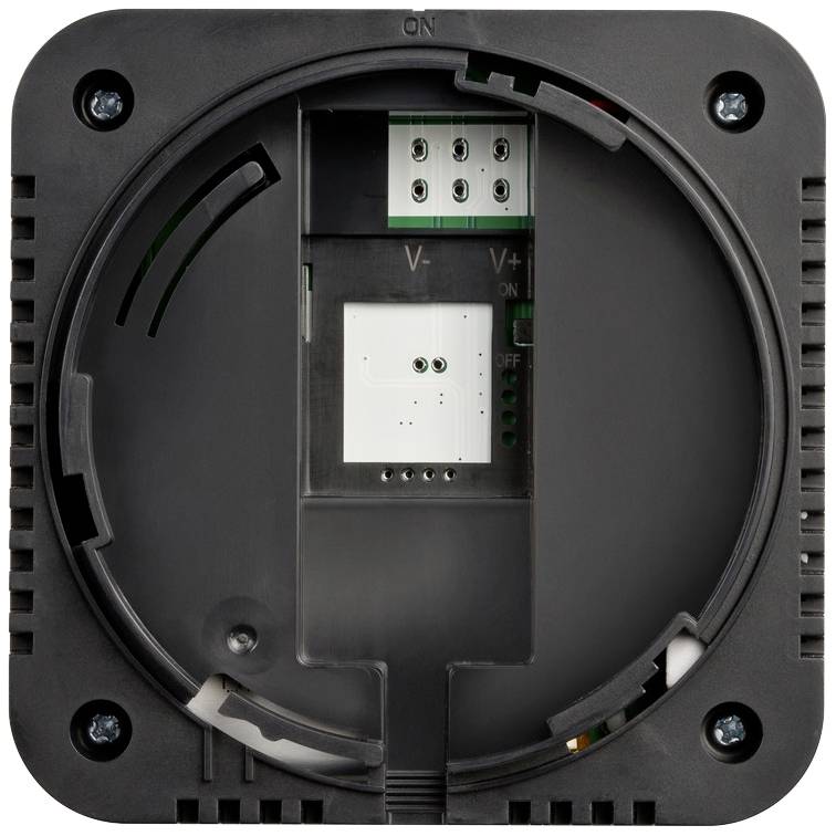 Dos d'un appareil électronique avec des ports de connexion pour le câblage, des trous de vis et un interrupteur dans les positions 'Marche' et 'Arrêt'.