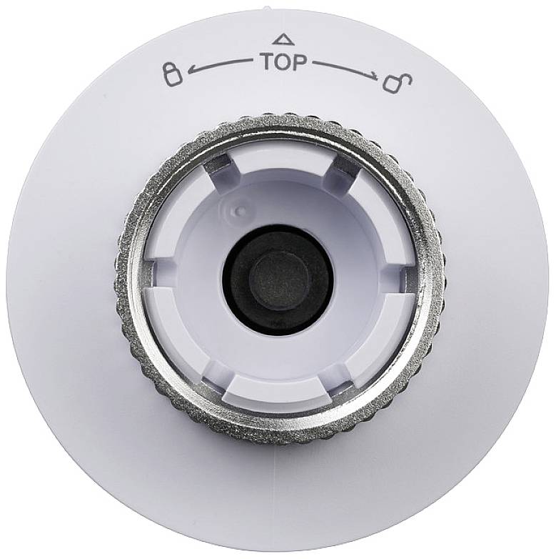 Tête de thermostat en gros plan avec des marquages pour instructions de réglage.