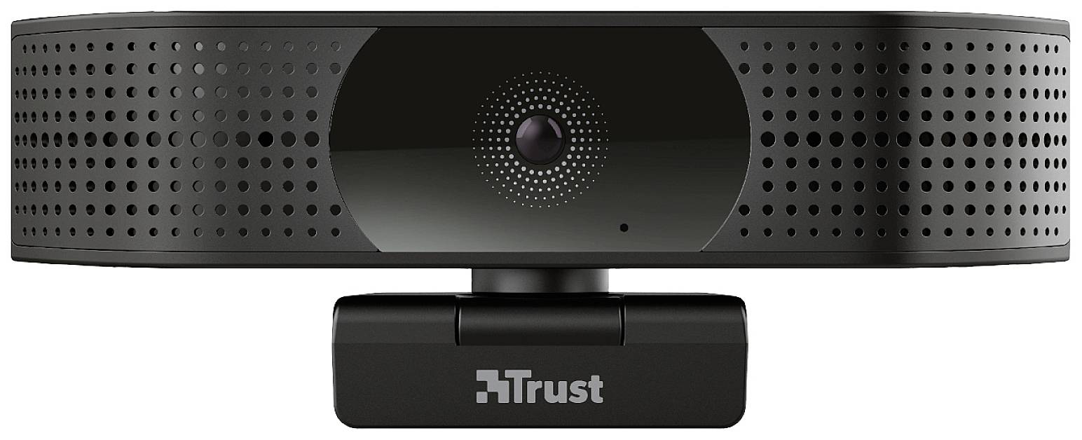 Une webcam noire avec un objectif central et un boîtier perforé. Le logo de la marque 'Trust' est visible en dessous.