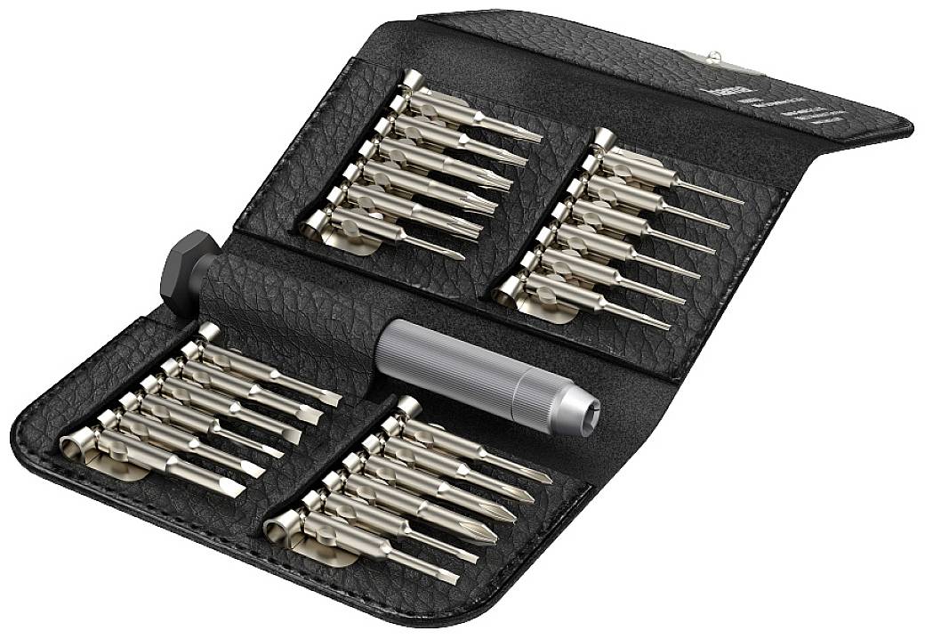 Un ensemble d'outils noir et gris avec plusieurs embouts de tournevis dans un étui rabattable. Comprend divers embouts pour des travaux de précision.