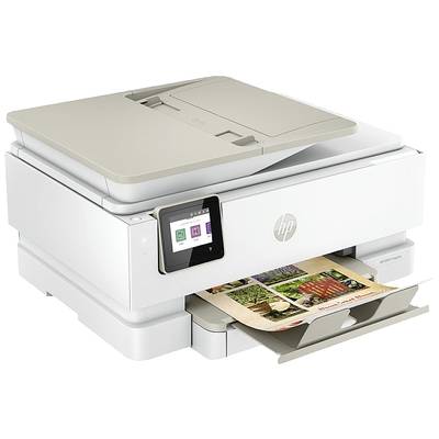 Une imprimante multifonction blanche avec écran tactile affiche le menu. Elle imprime une photo en couleur.