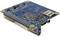 Petite carte électronique bleue avec différentes connexions, dont USB et microSD, et des composants de circuit visibles.