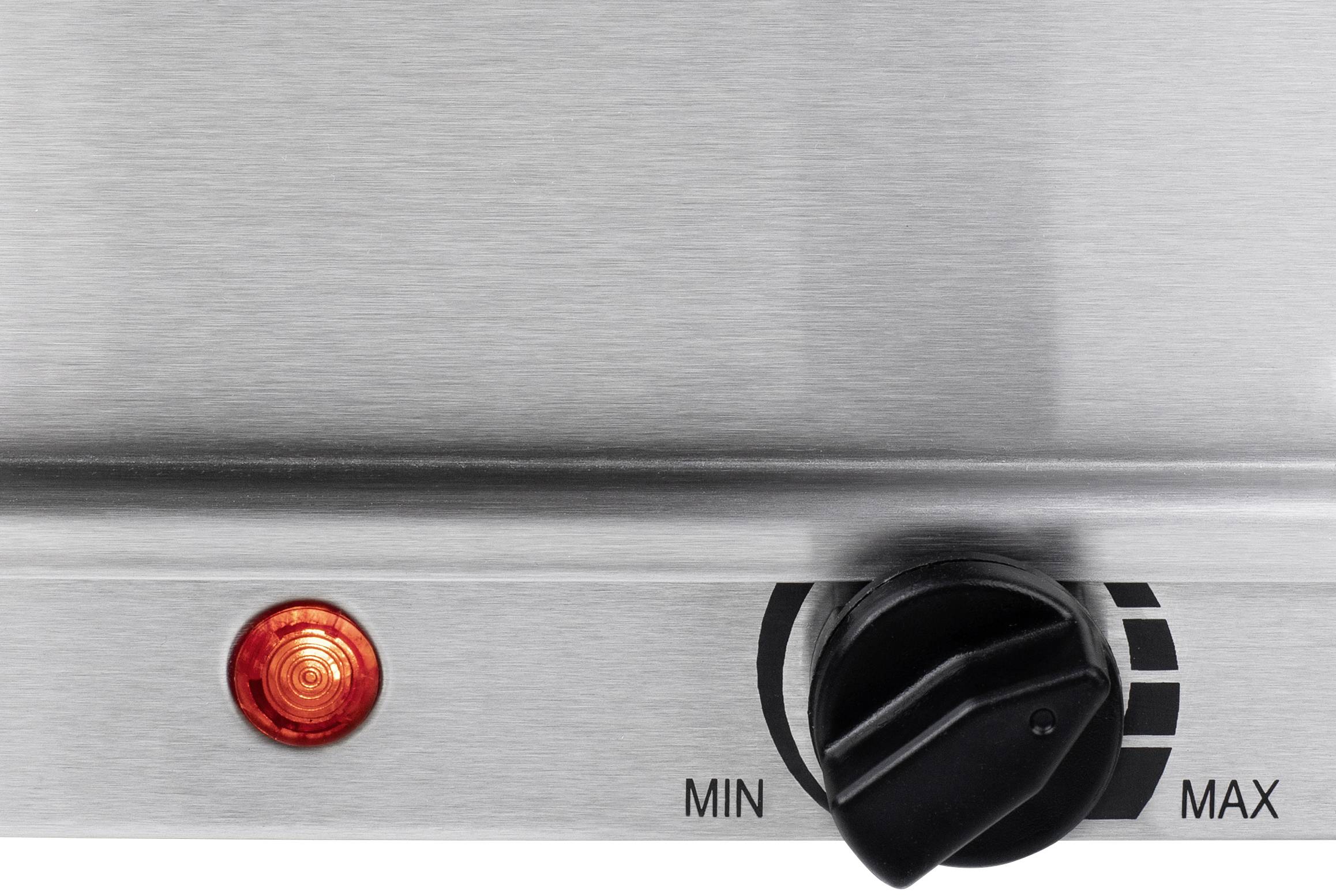 Surface métallique avec une lumière rouge et un bouton rotatif noir. Le bouton présente une échelle allant de 'MIN' à 'MAX'.