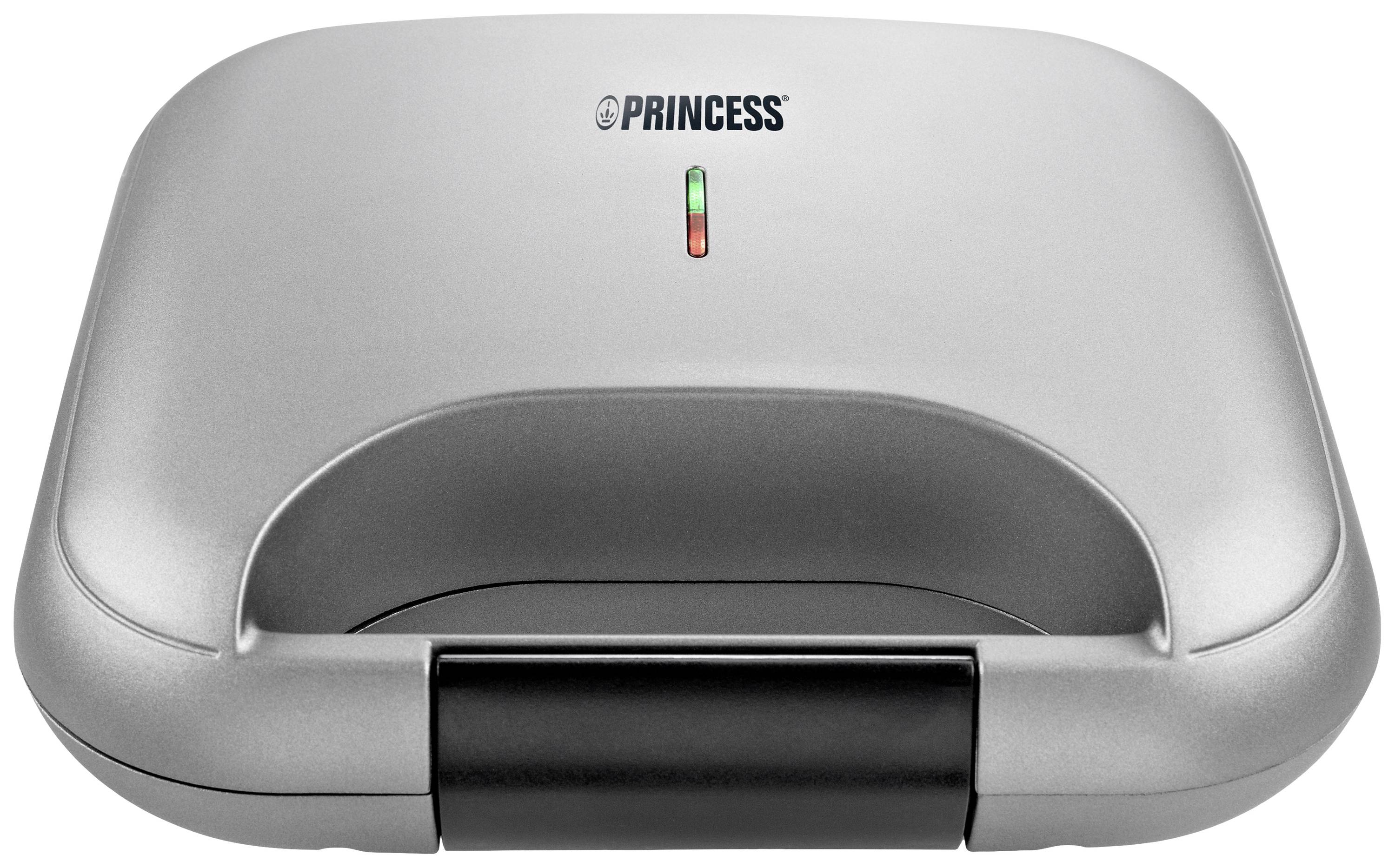 Appareil à sandwich fermé avec boîtier argenté et témoin lumineux sur le dessus.