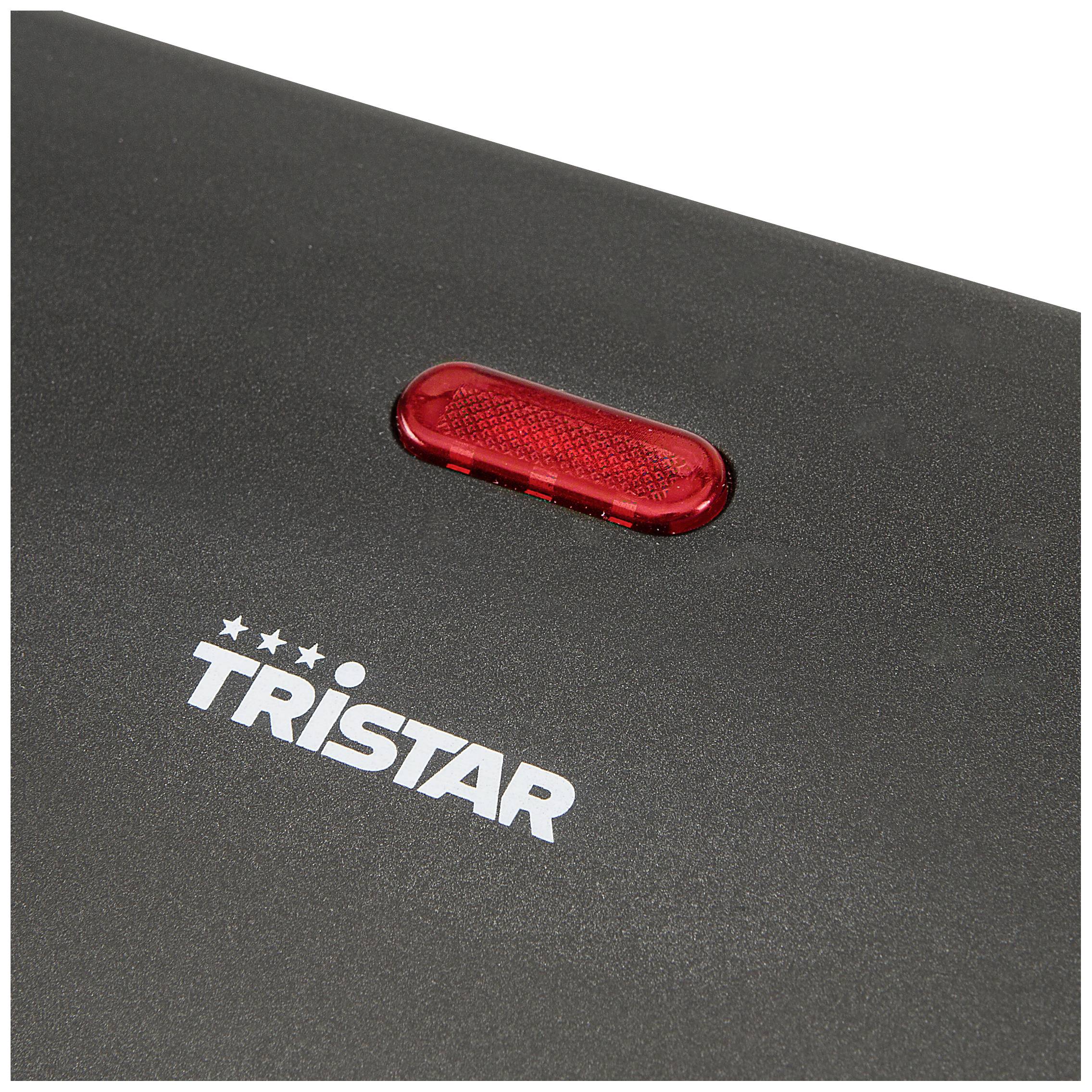 Surface noire avec un signal lumineux rouge et le mot 'TRISTAR' en écriture blanche.
