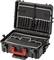 Une valise rigide noire ouverte avec une poignée rouge montre plusieurs compartiments et poches à l'intérieur du couvercle pour le rangement et l'organisation.