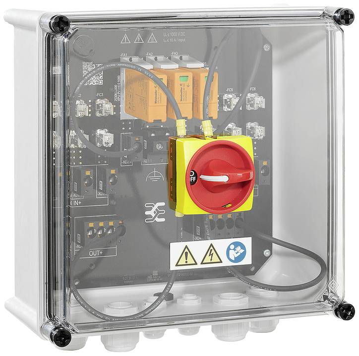 Boîtier électronique de commande dans un boîtier transparent avec un bouton d'arrêt d'urgence rouge. Des symboles de sécurité et de fonction sont visibles.