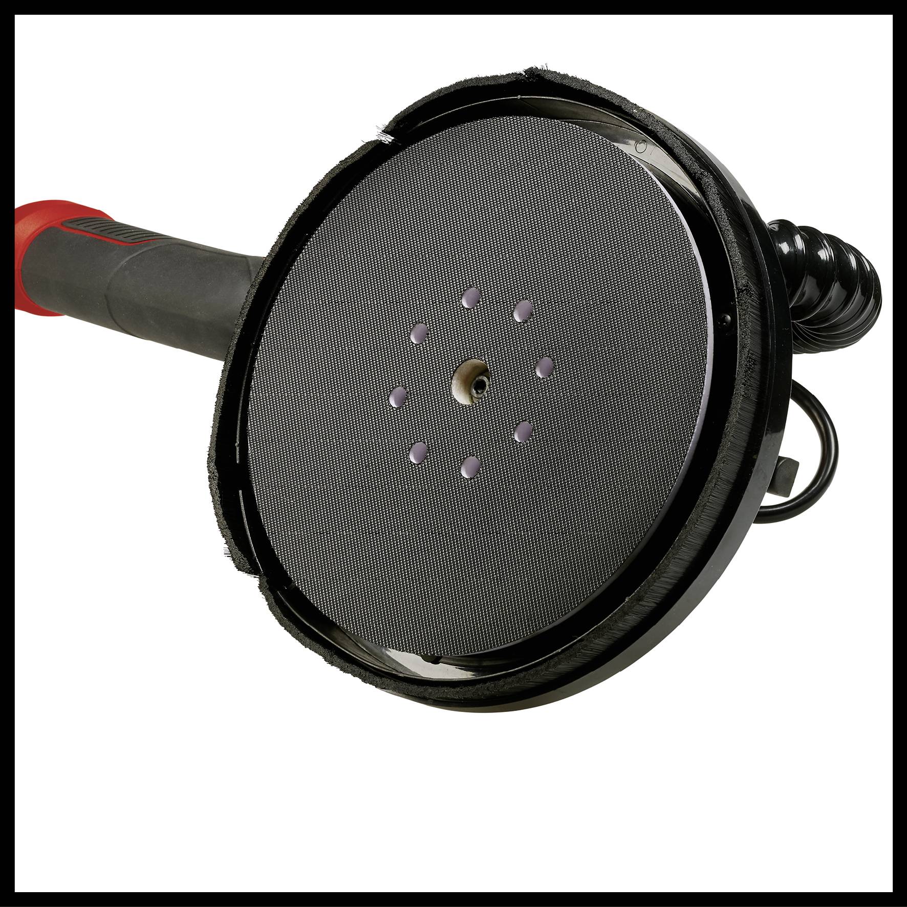 Meuleuse avec plateau de ponçage circulaire au premier plan, poignée noire avec un accent rouge, adaptée aux travaux manuels et au polissage.