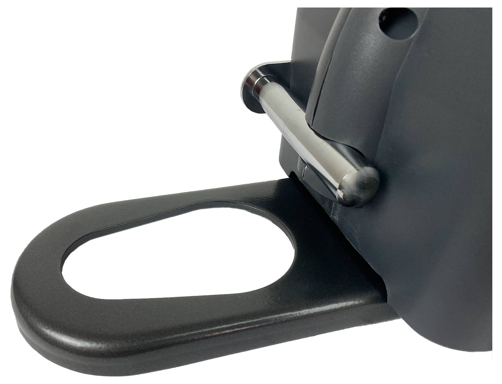 Une poignée noire, ovale, est fixée à un appareil, probablement pour sa stabilisation ou son transport.