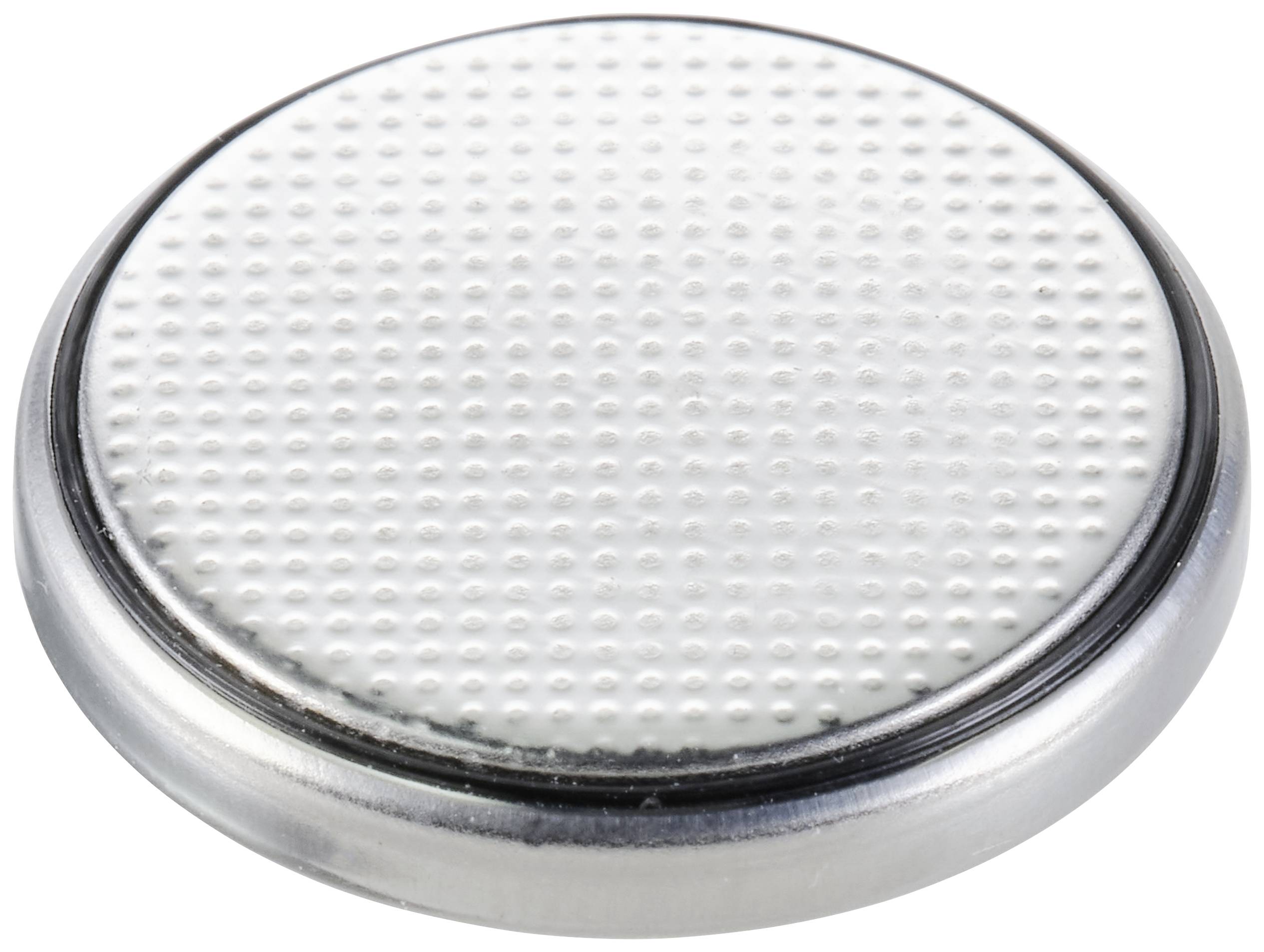 Batterie bouton en argent avec un motif structuré sur sa surface supérieure, typiquement utilisée dans les petits appareils électroniques.