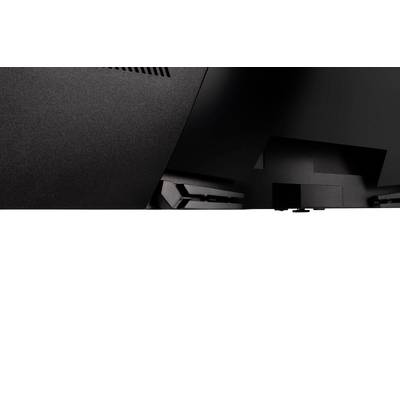 Gros plan d'un appareil électronique noir avec des fentes de ventilation et des bords texturés dans la partie supérieure de l'image.
