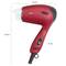Sèche-cheveux de voyage rouge avec poignée noire, 1300 watts, dimensions : 170 mm de largeur, 235 mm de hauteur. Deux vitesses, pliable.