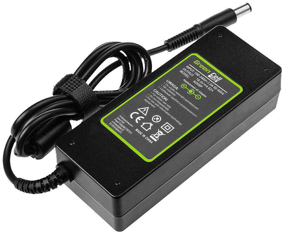Chargeur noir avec câble et fiche, autocollant vert 'Green Cell', indications de tension et symboles de sécurité.