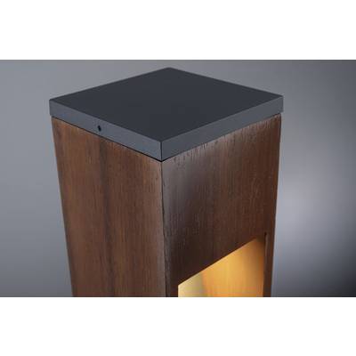 Lampe moderne en bois avec un intérieur lumineux qui diffuse une lumière chaleureuse. La partie supérieure est en métal noir.