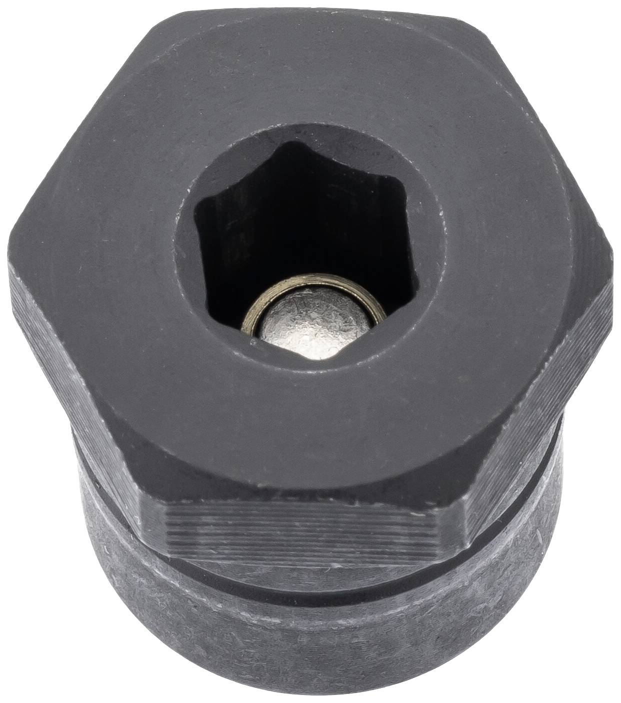 Gros plan sur un outil hexagonal noir avec un noyau métallique rond en son centre.