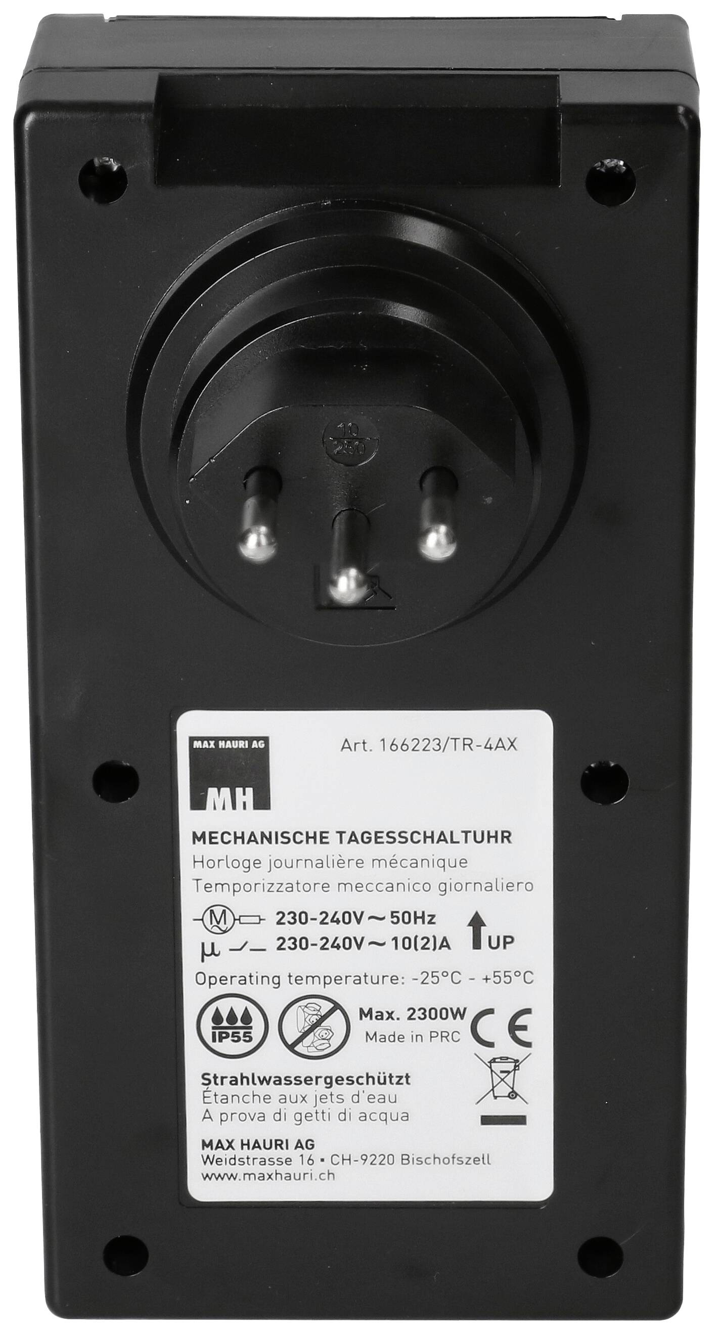 Appareil noir avec trois contacts de branchement. L'autocollant affiche des informations utilisateur en plusieurs langues. Plage de fonctionnement : 230-240 V, -25°C à +55°C.