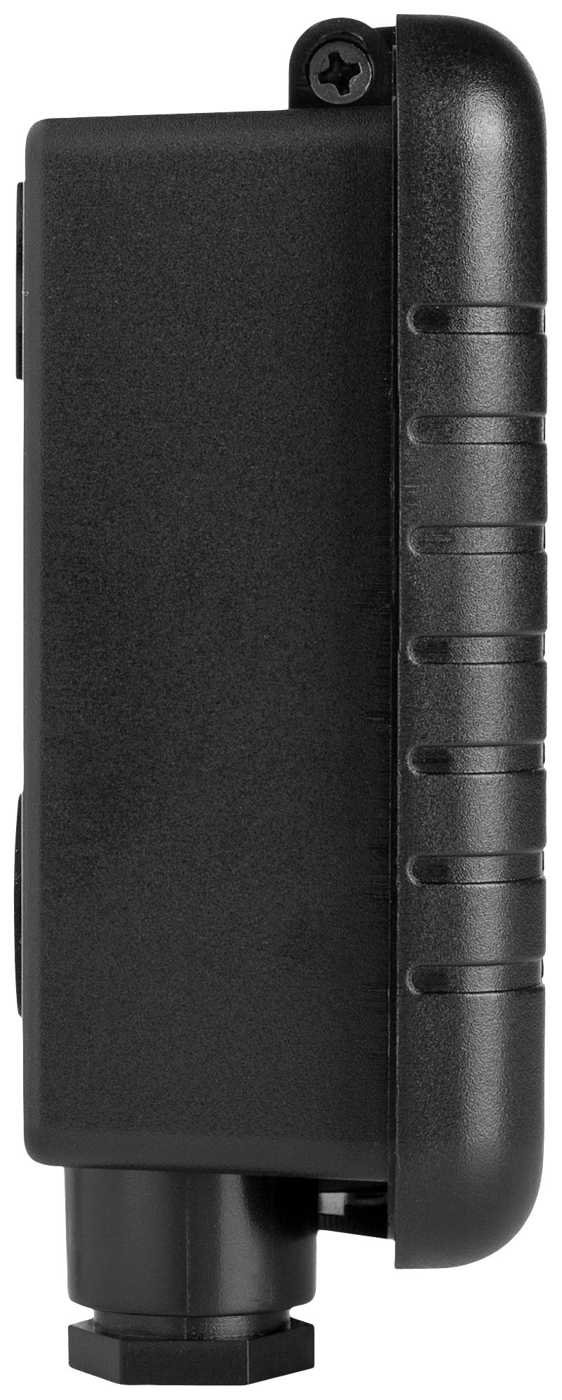 Un appareil noir rectangulaire avec un bord texturé et une connexion de câble en bas.