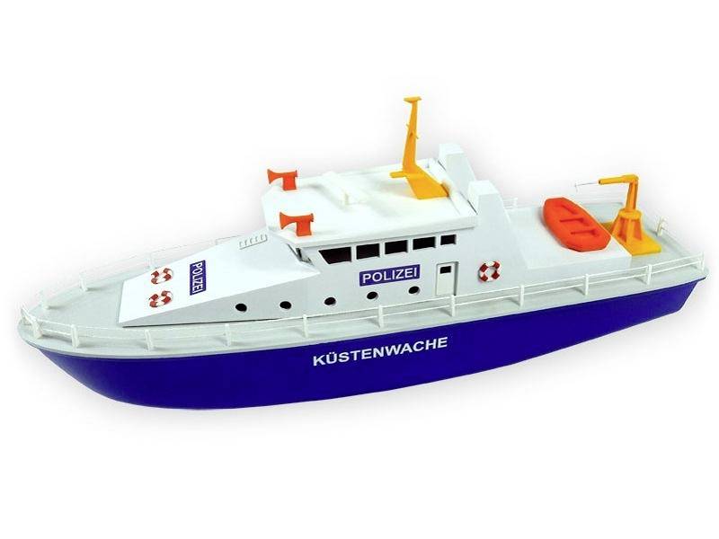 Un modèle d'un bateau de la garde côtière de la police en bleu et blanc avec des bouées de sauvetage, un système radar et une inscription 'POLIZEI'.