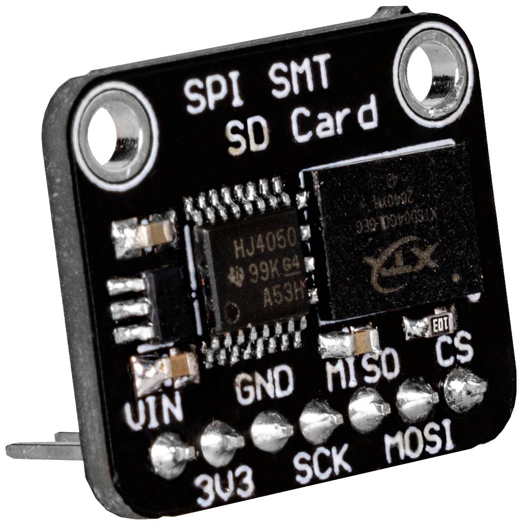 Petit module noir portant l'inscription 'SPI SMT SD Card'. Connexions visibles : VIN, GND, MISO, CS, 3V3, SCK, MOSI.