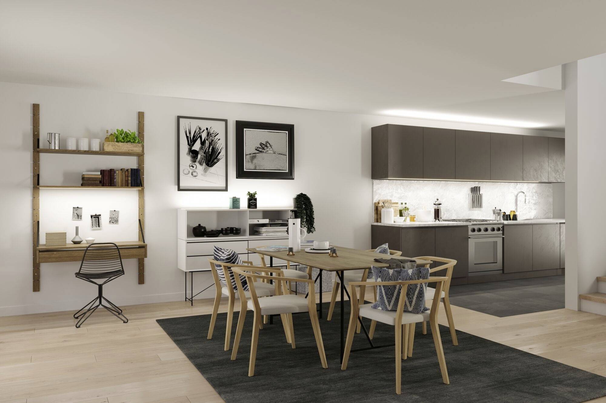 Espace repas moderne avec une table en bois et six chaises sur un tapis foncé. À l'arrière-plan, cuisine ouverte, étagère décorative et deux tableaux en noir et blanc.