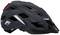 'Casque de vélo noir avec des ouvertures de ventilation, des réflecteurs et un feu arrière rouge. Sur le côté, on aperçoit un logo stylisé en forme de 'F'.'