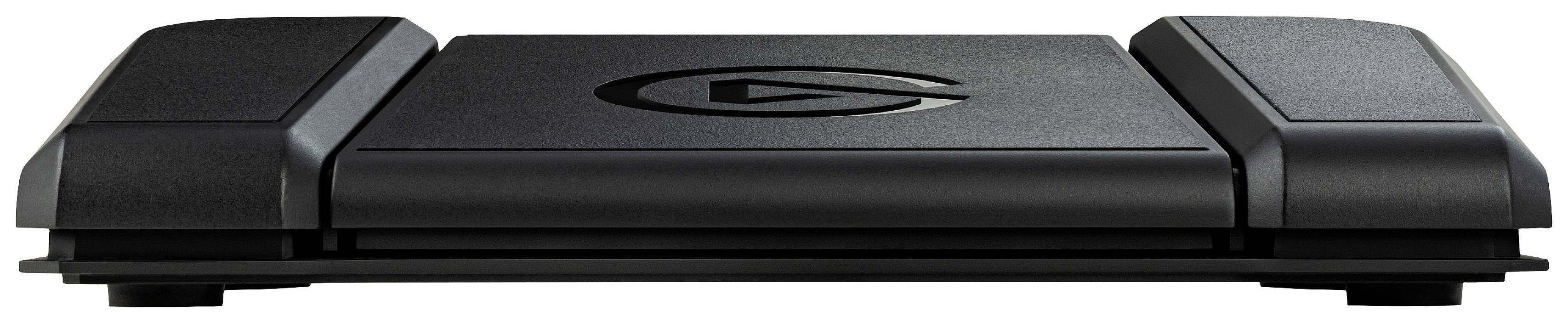 Pédale noire, rectangulaire, avec un logo central stylisé en forme de 'G'. Design plat et moderne, probablement un commutateur au pied.