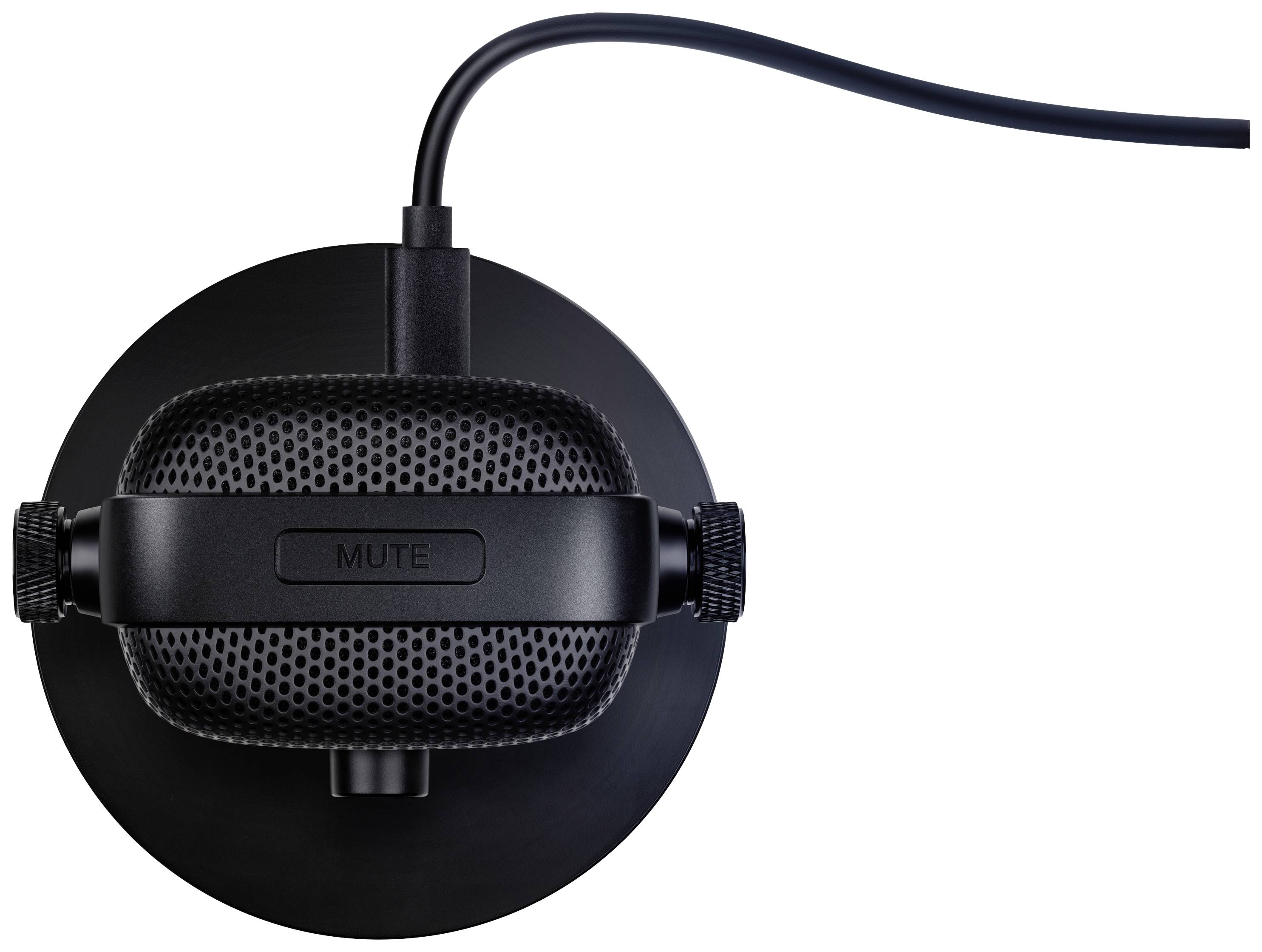 Microphone noir vu de dessus, avec un grand bouton de sourdine et un câble connecté, posé sur un support circulaire noir.