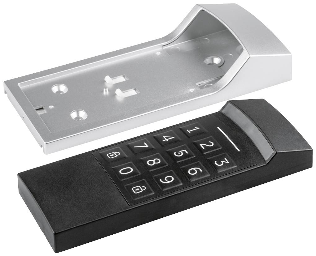 'Clavier dans un boîtier noir avec pavé numérique, couvercle argenté détaché, utilisé pour le contrôle d'accès.'