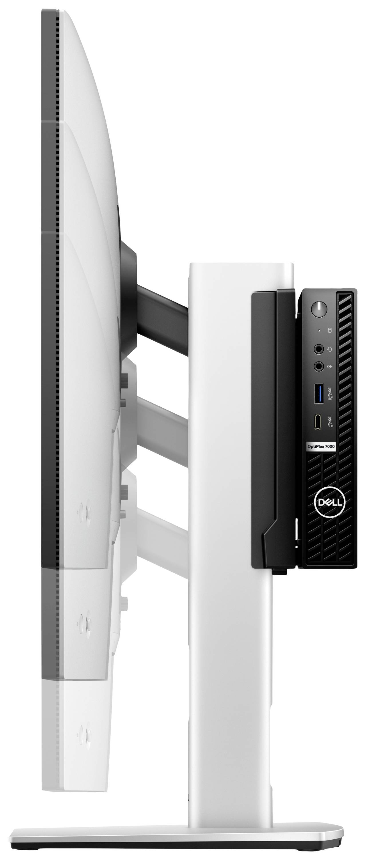 Un écran d'ordinateur vu de côté. Un petit ordinateur noir est fixé à l'arrière.