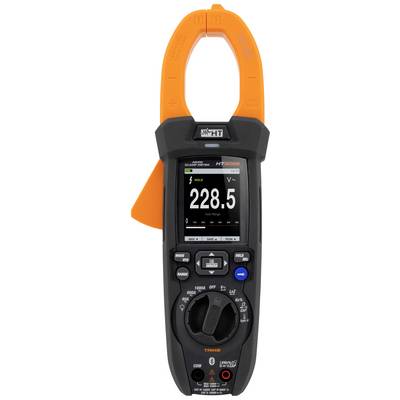 Un multimètre numérique affiche 228,5 volts sur son écran. L'appareil est équipé de pinces ampèremétriques oranges et de boutons de commande noirs.