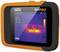 Un appareil de thermographie orange et noir affiche un écran thermique avec des températures allant de 44,7°C à 21,9°C et une moyenne de 30,8°C.