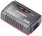 Un chargeur de batterie rectangulaire avec un boîtier noir et un bord rouge. On peut y lire 'VCHARGE-CX' et des voyants LED pour indiquer le statut.