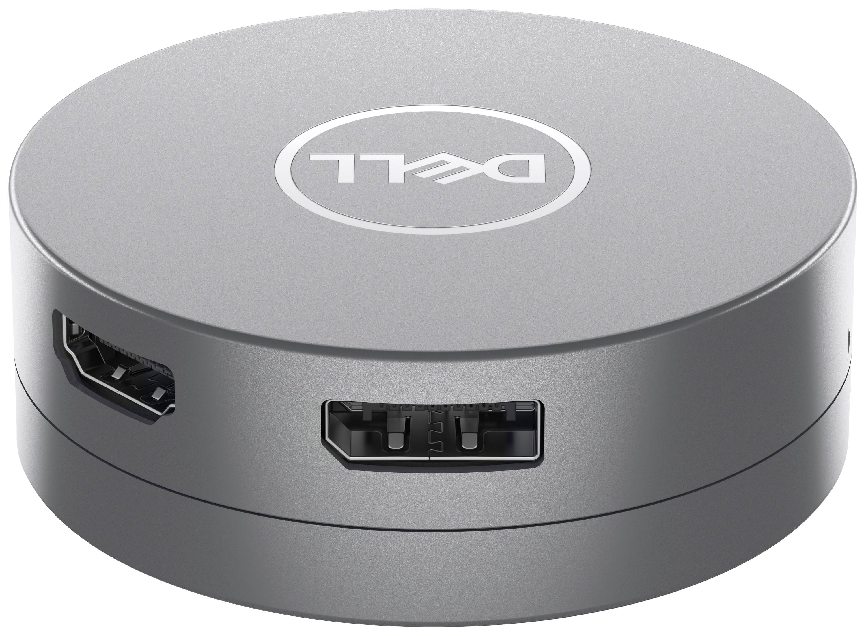 Adaptateur rond gris de Dell avec des ports HDMI et USB, utilisé pour connecter des périphériques externes à des ordinateurs.