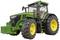 Un tracteur vert avec de grandes roues robustes et un contrepoids frontal prononcé, adapté aux travaux agricoles.
