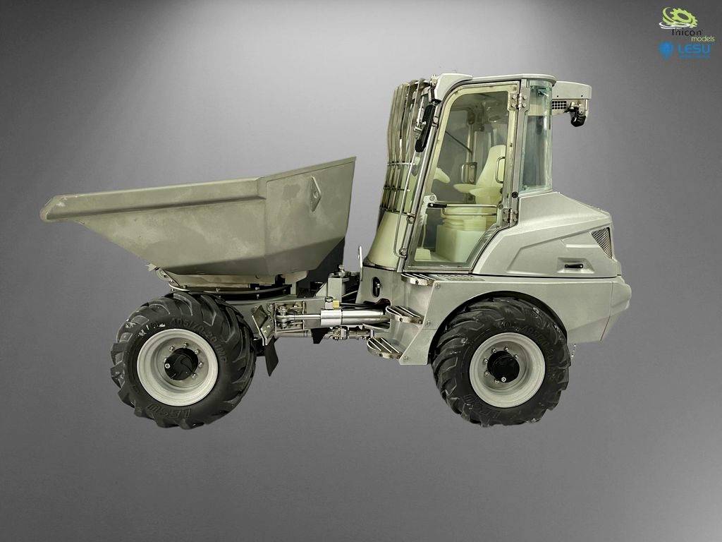 Un pelleteuse beige à quatre roues et avec une benne ouverte est positionné sur le côté contre un fond gris.